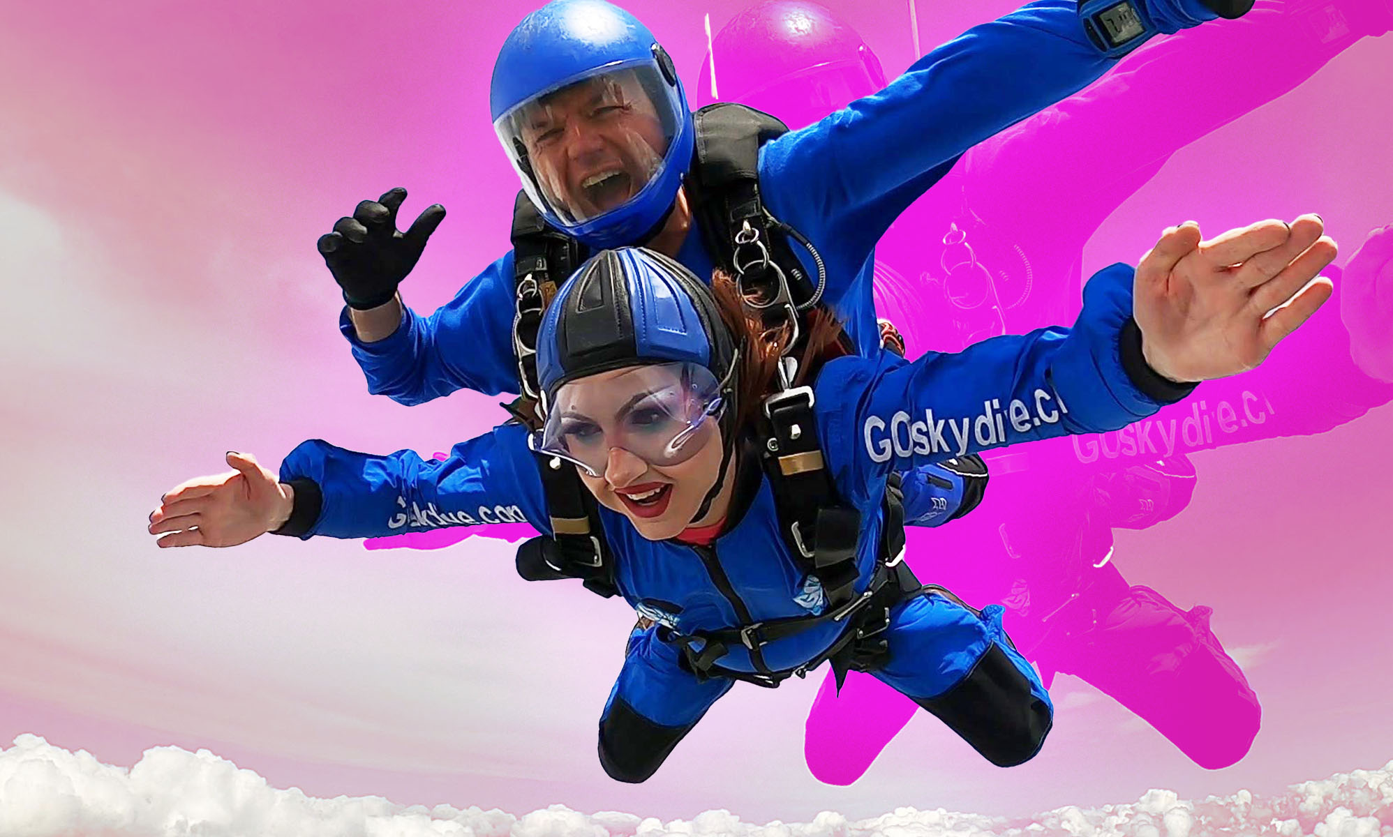 The image shows Rosie Zinfandel, a drag queen, skydiving. She is falling through the air and can be seen wearing full make-up and fake eyelashes.