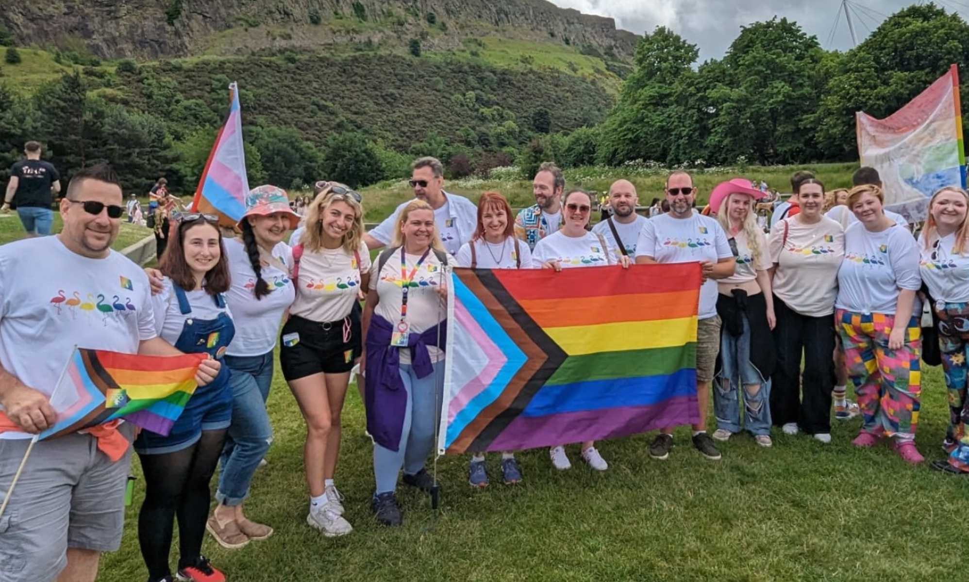 Edinburgh Zoo staff at Edinburgh Pride holding flag