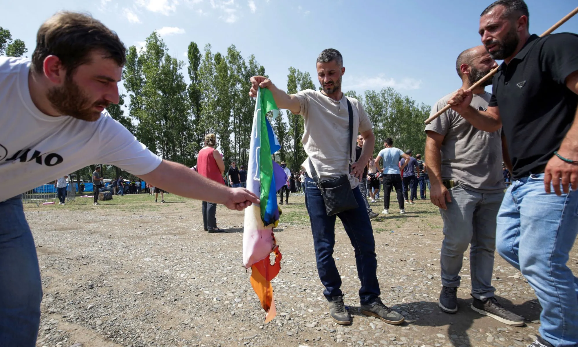 A group of anti-LGBTQ+ protestors stormed Tbilisi Pride in Georgia and set fire to rainbow flags.