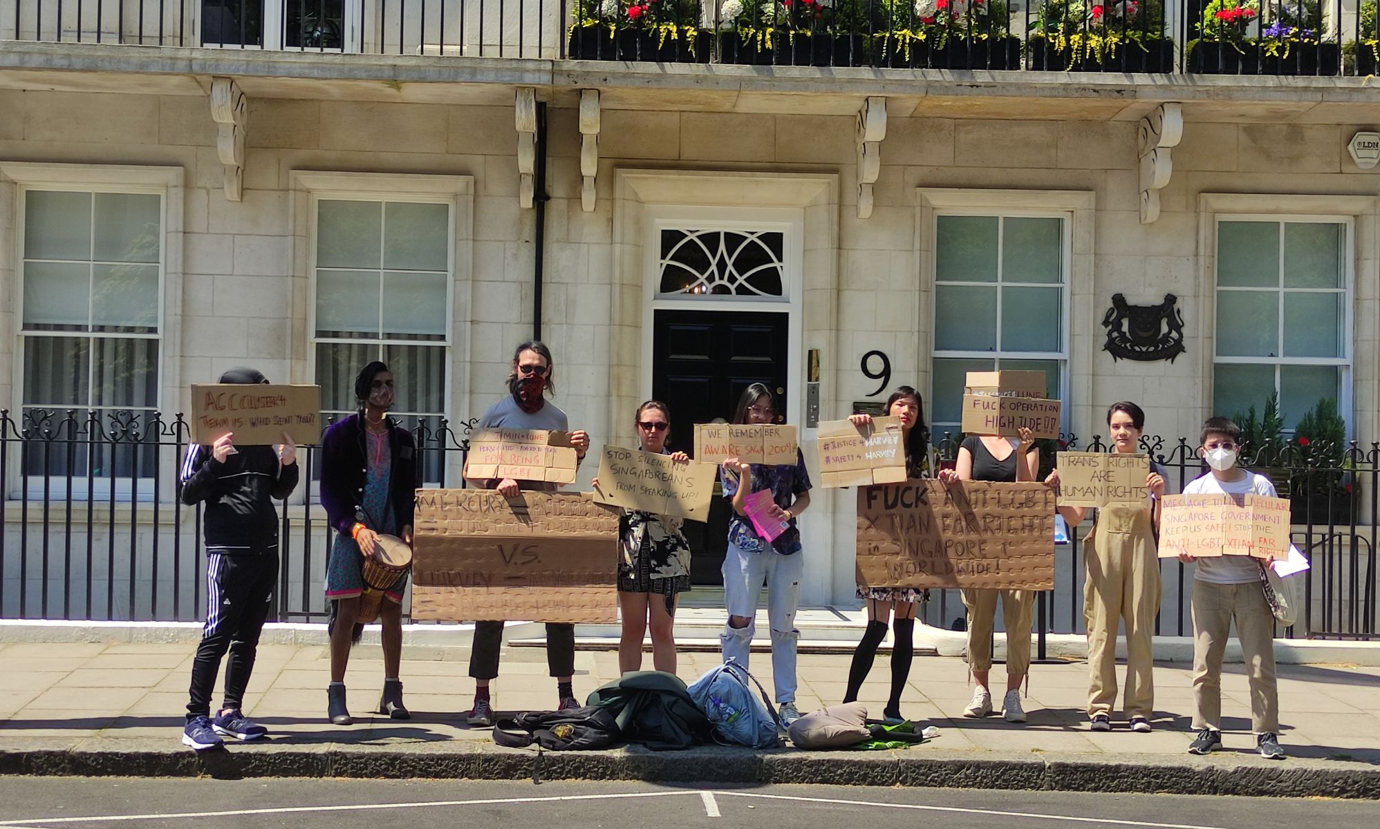 A group of people gather outside the Singapore High Commission in London, UK to protest attacks against the queer and trans people as well as the LGBTQ+ community in Singapore