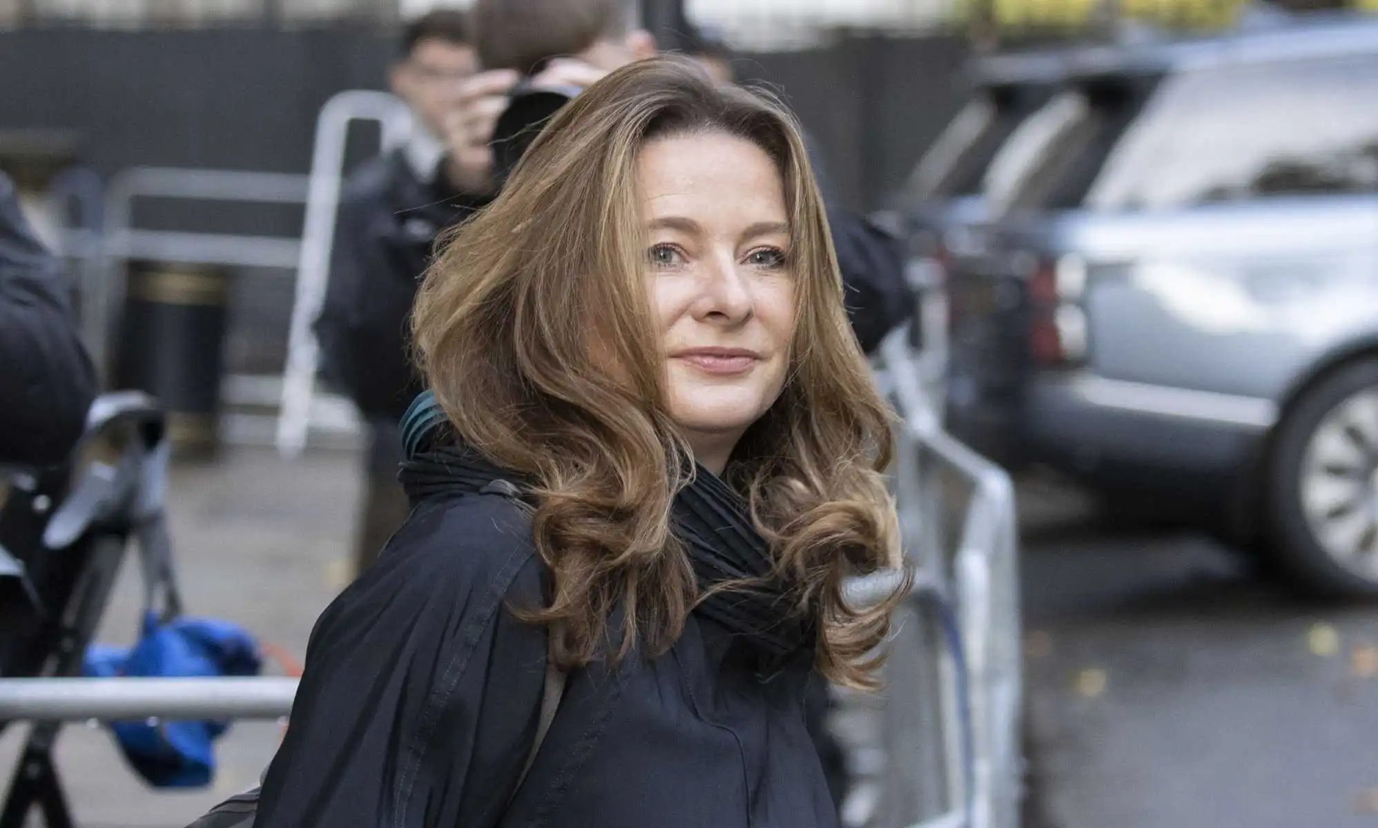A photo shows education secretary Gillian Keegan wearing a black coat as she leaves Downing Street
