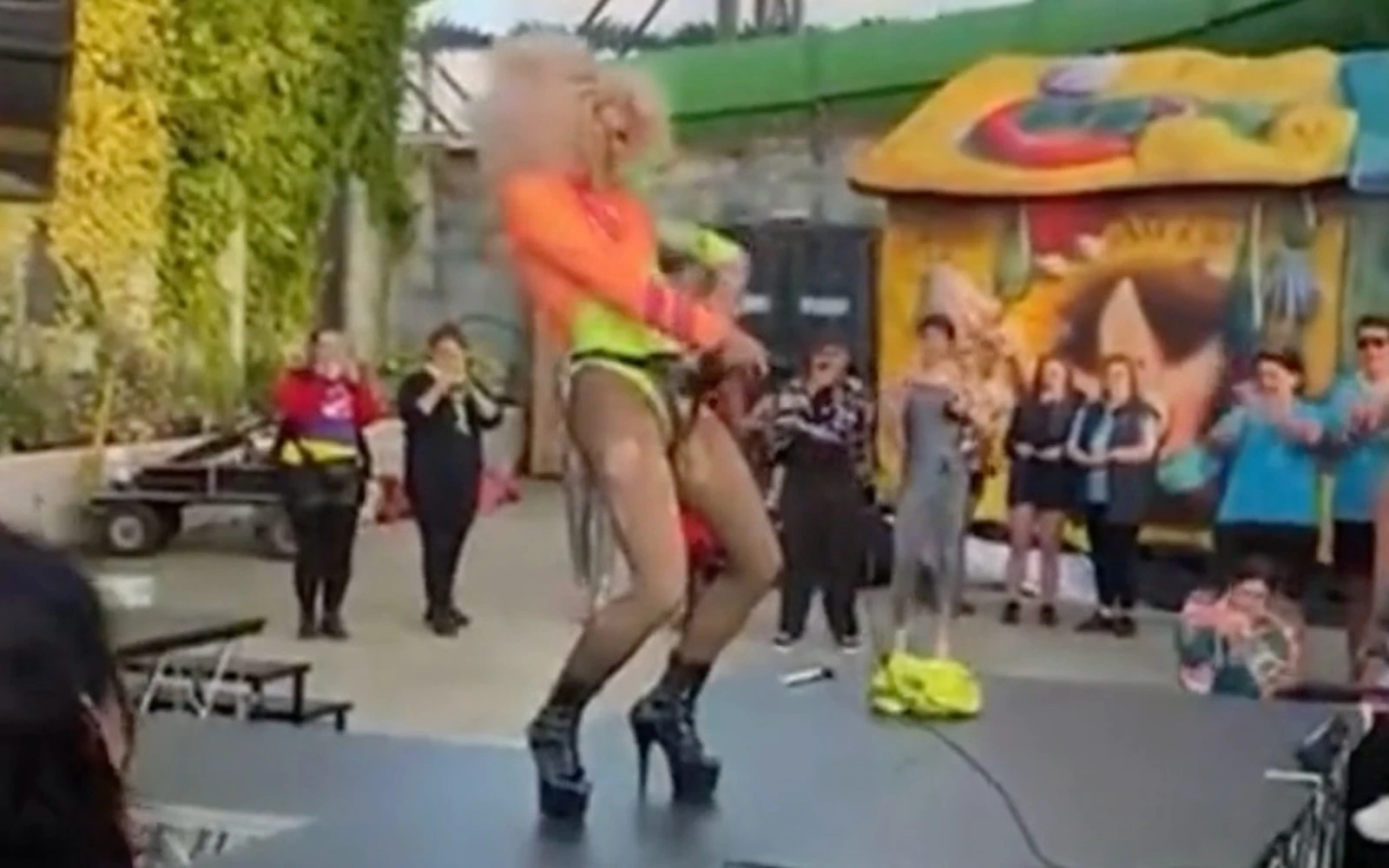 Crystal from Drag Race UK uses an angle grinder at a show in Essex