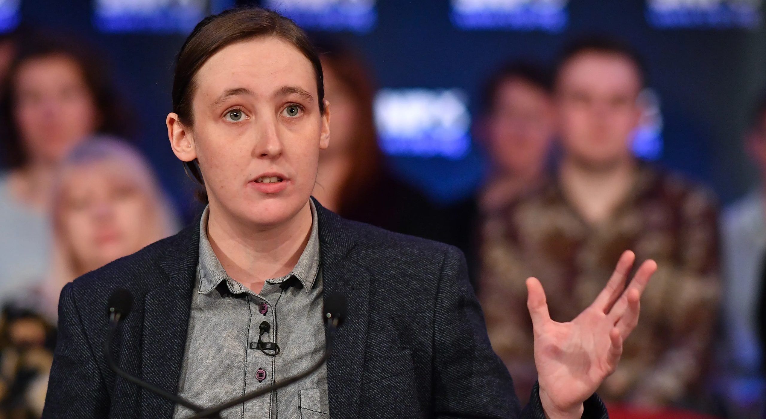 SNP MP Mhairi Black wears a grey shirt and dark blazer