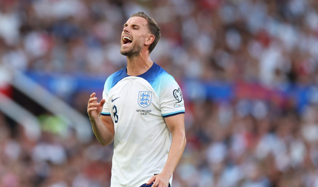 England footballer Jordan Henderson wearing a white and blue strip during a match