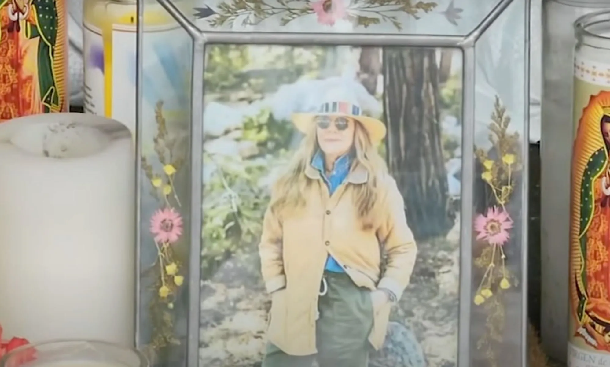 A picture of California store owner Laura Ann Carleton in a frame with flowers set up during a memorial after Carleton was fatally shot by an unidentified man who made
