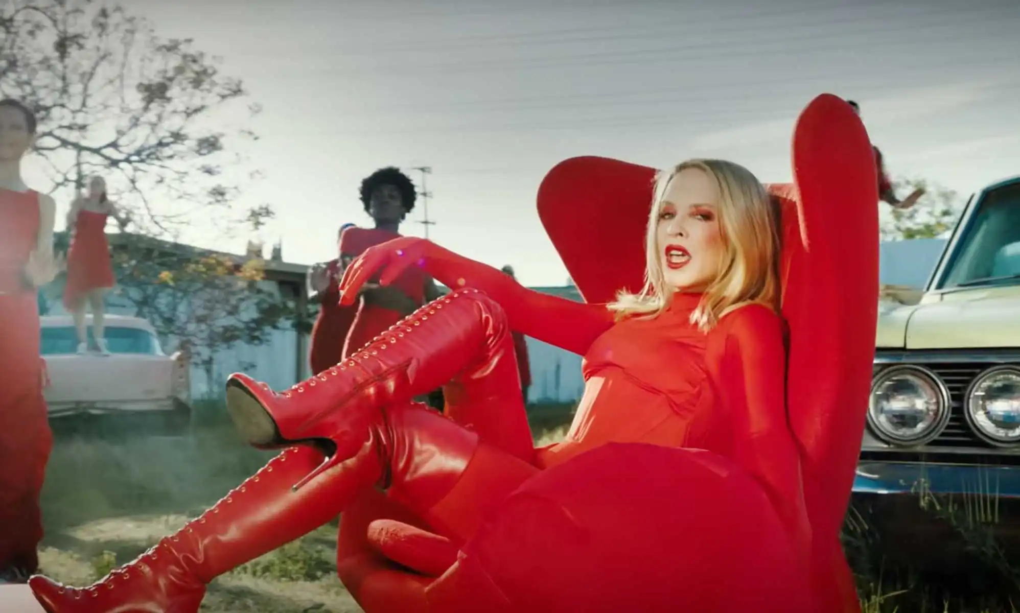 Kylie Minogue wears all red during the Padam Padam music video.