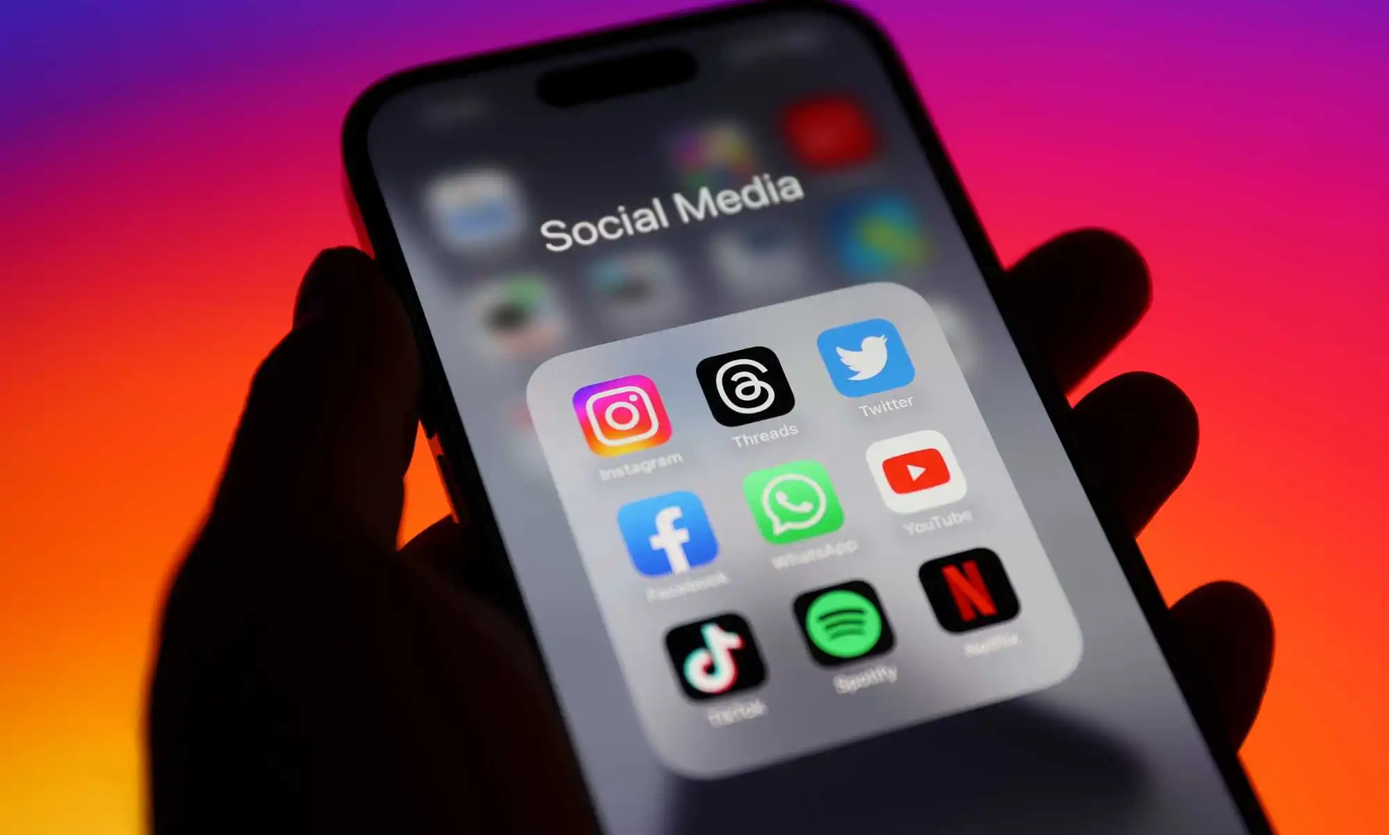 Apps on smartphone including Netflix Spotify TikTok and Instagram