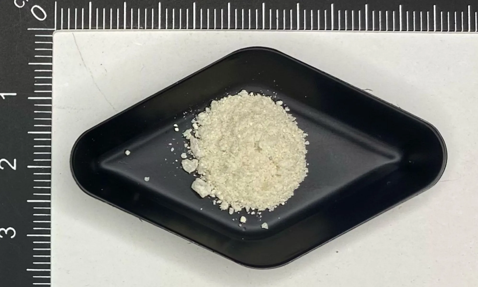 A picture of a powdered drug being sold as MDMA.