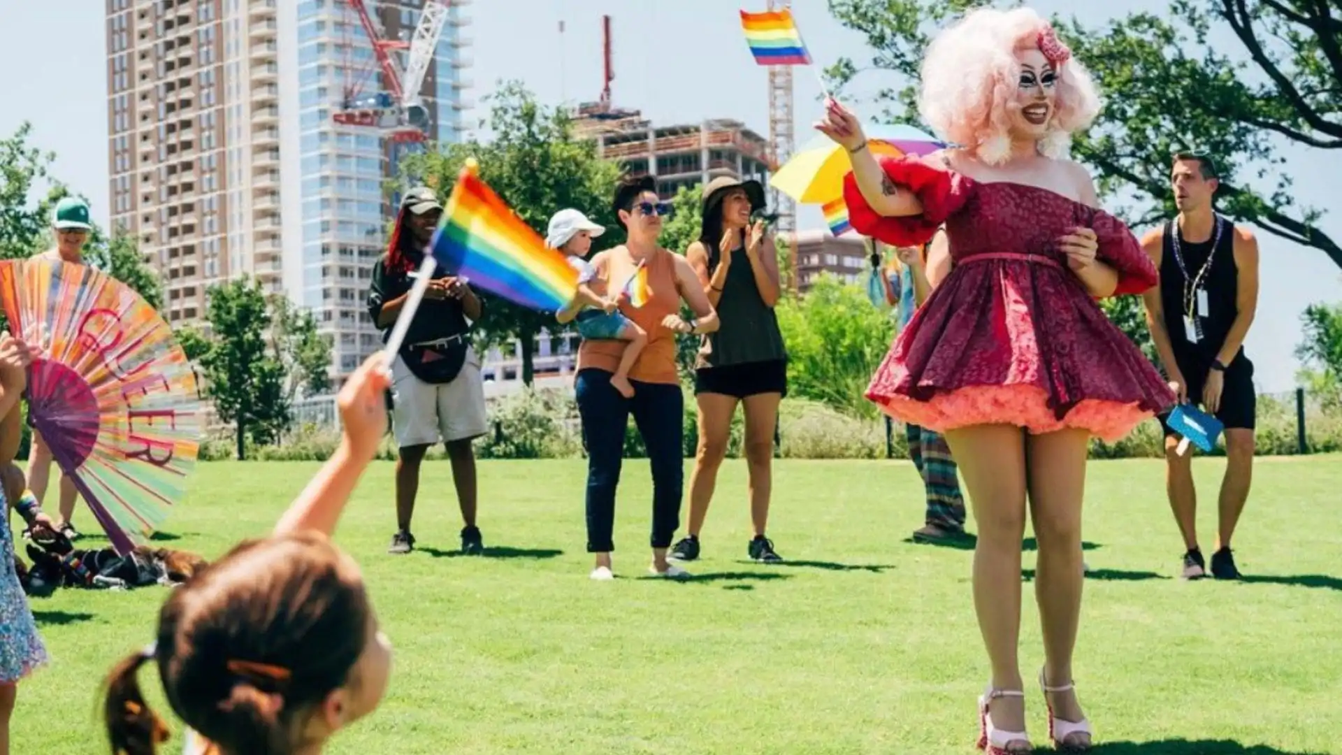 Texas drag queen Brigitte Bandit hosting a story time hour outdoors.