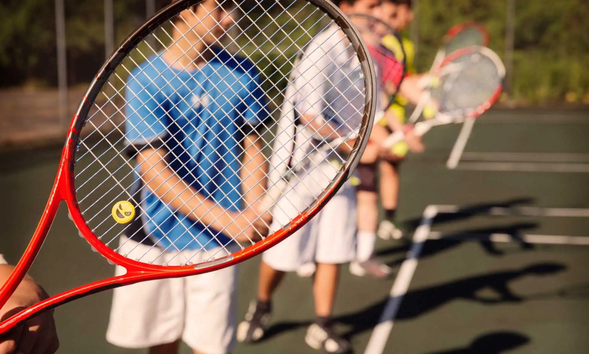 Students playing tennis.