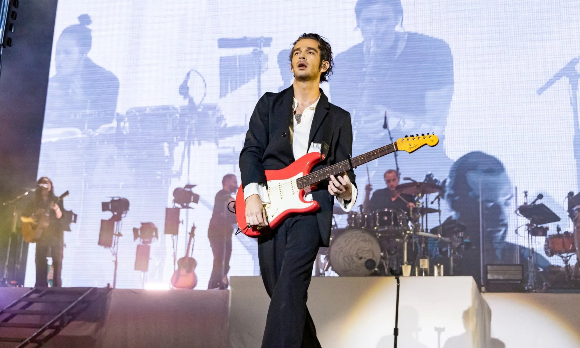 The 1975 frontman Matty Healy performing on stage