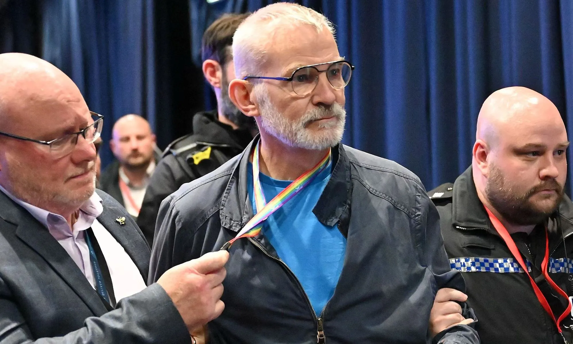 Andrew Boff being escorted out of the Tory Party Conference.
