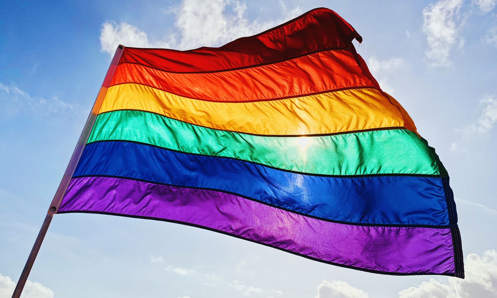 Stock image of a rainbow flag waving