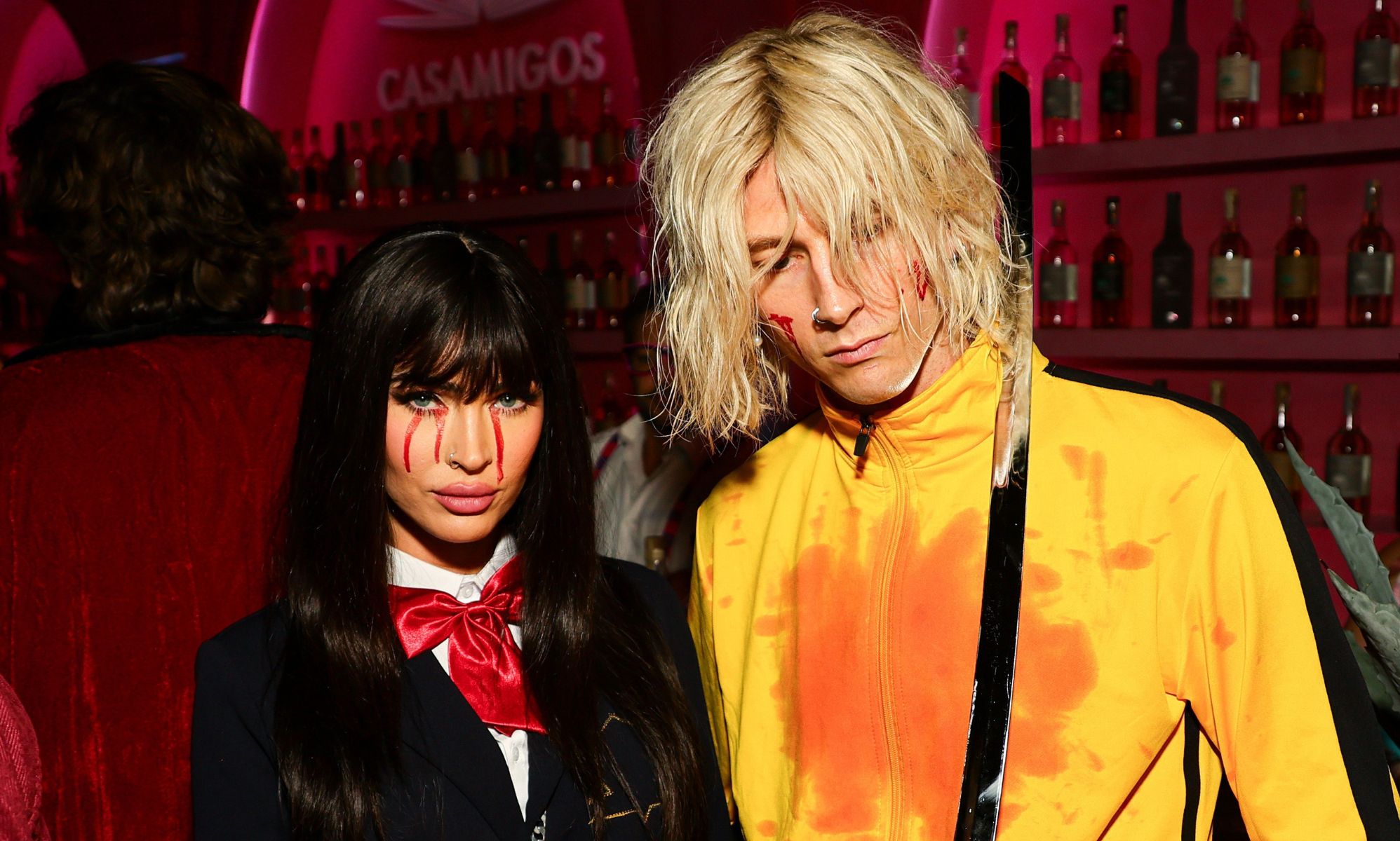 Megan Fox (left) and boyfriend Machine Gun Kelly (right) dress as Kill Bill characters for Halloween.