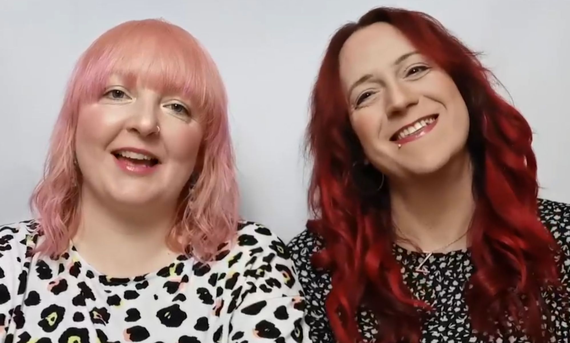 Zoey (right) and Kelly (left), pictured smiling.