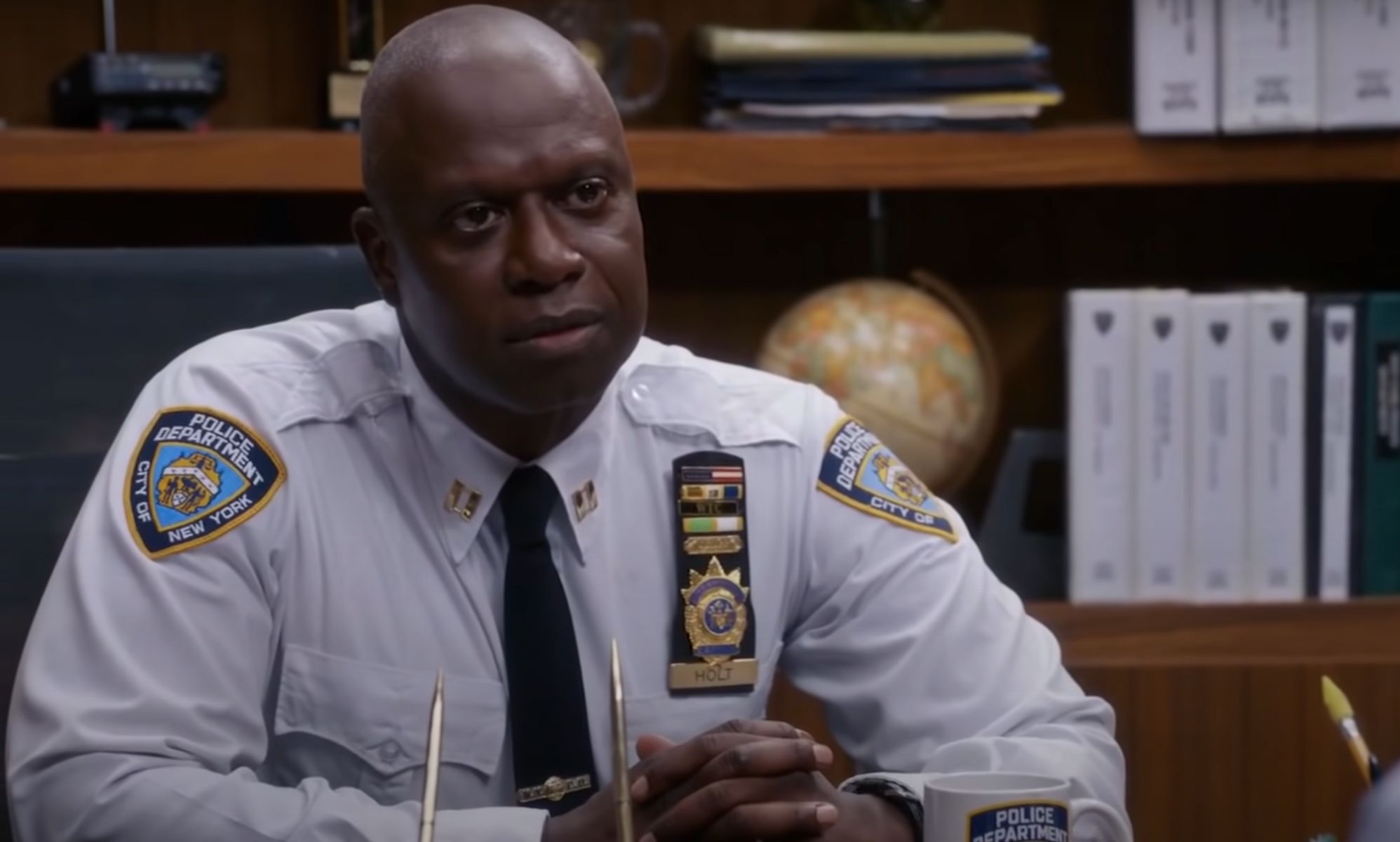 A still screenshot of Andrew Braugher wearing a police uniform while playing the Brooklyn Nine-Nine (also stylised Brooklyn 99) character Captain Raymond Holt
