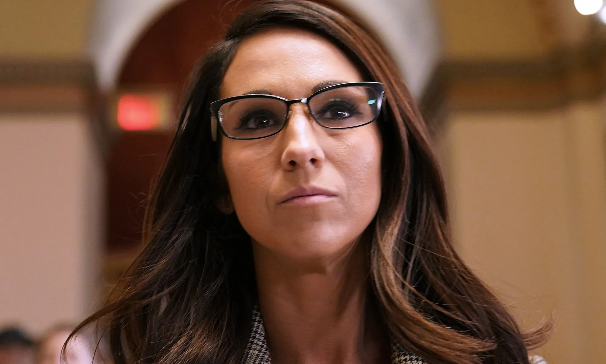 Lauren Boebert, pictured walking down a hallway in congress.