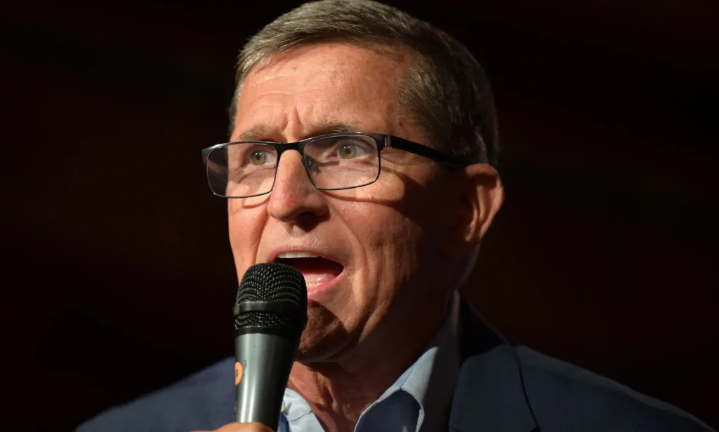 Michael Flynn, holding a microphone close to his face.