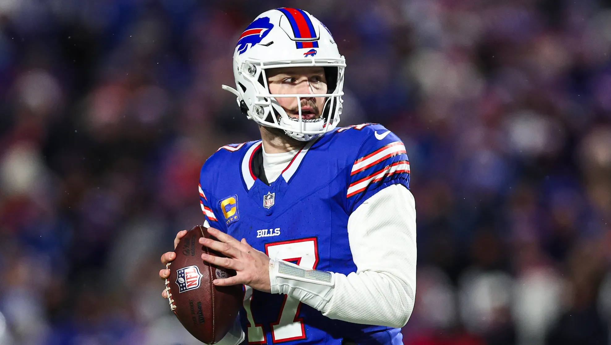 ORCHARD PARK, NY - JANUARY 21: Josh Allen #17 of the Buffalo Bills drops back to pass during an NFL divisional round playoff football game against the Kansas City Chiefs at Highmark Stadium on January 21, 2024 in Orchard Park, New York.