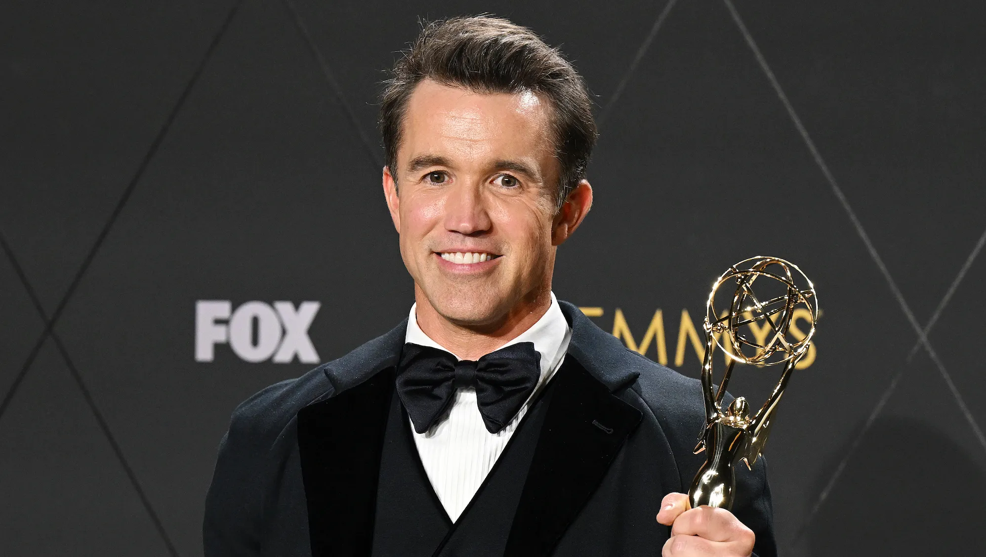 Rob McElhenney pictured holding an Emmy award in 2024