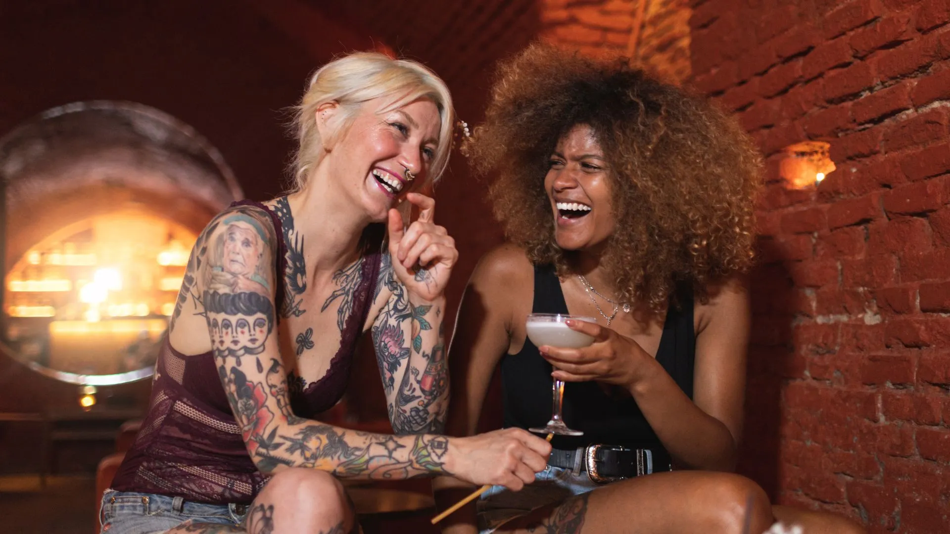 Stock image of two women in a bar to illustrate opening of London lesbian bar La Camionera