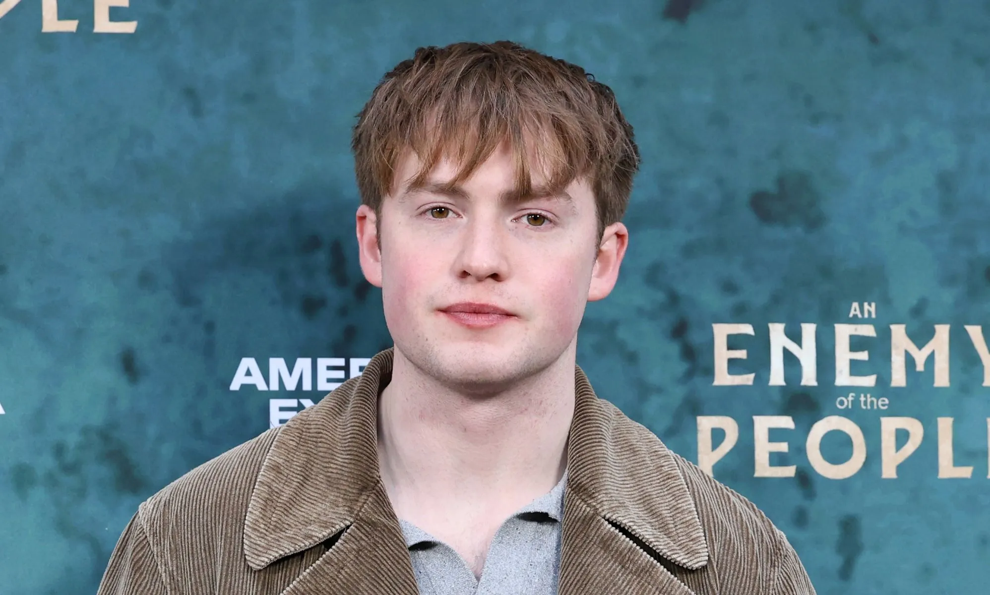 Kit Connor in a grey top and jacket