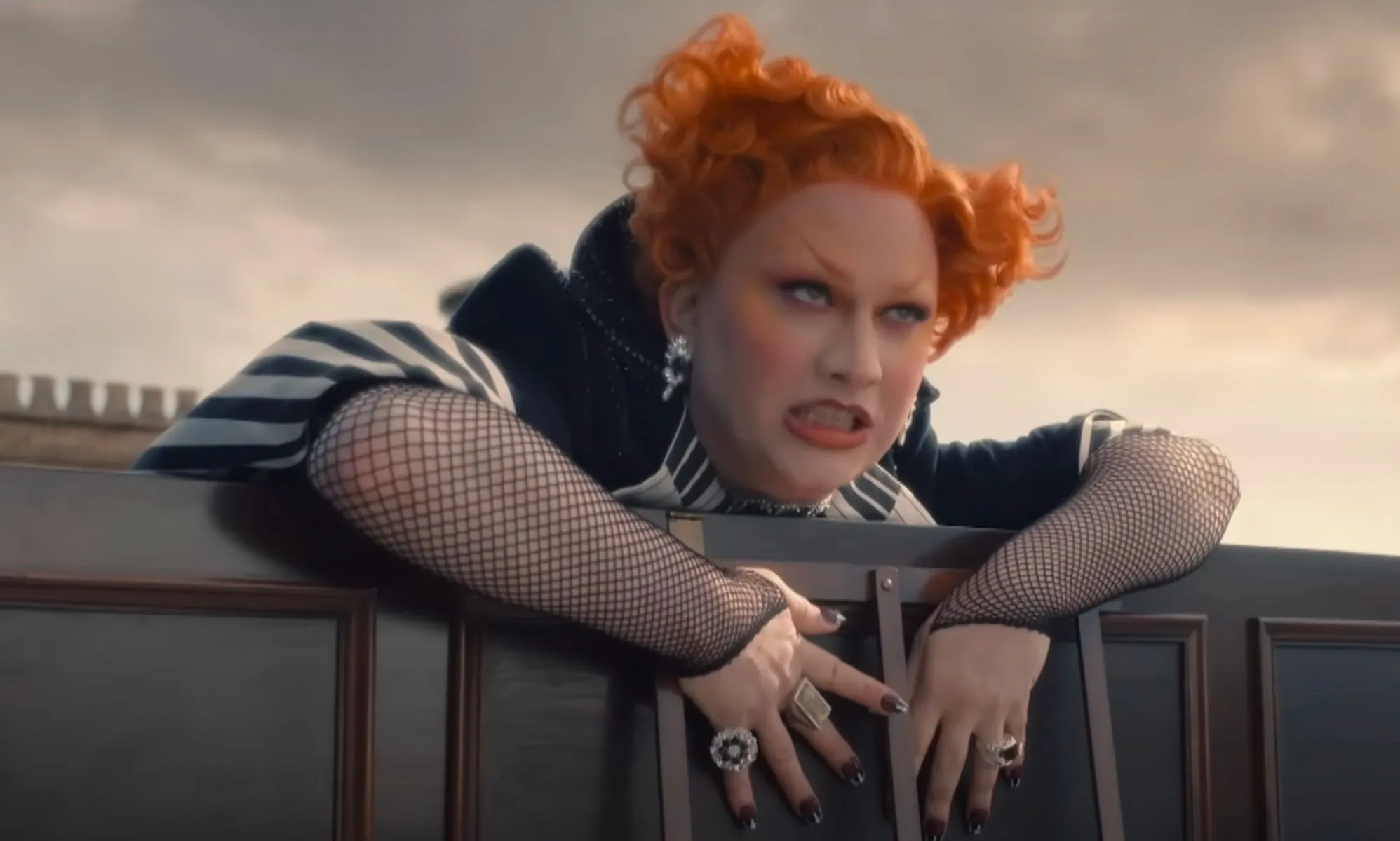 DRAG RACE star Jinkx Monsoon bears her teeth as she climbs over a piano in the new Doctor Who trailer.