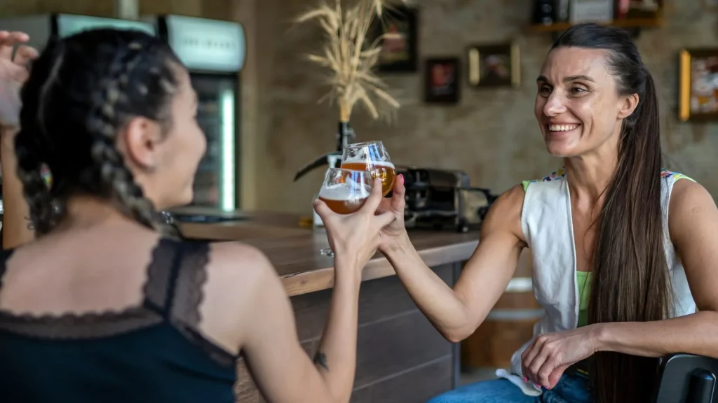 Stock image of two women at a lesbian bar