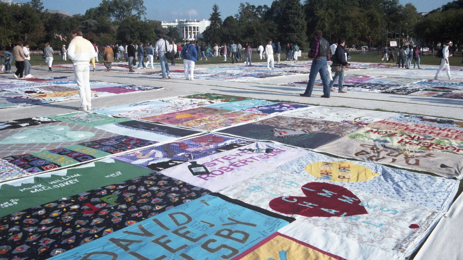 Visitors to the AIDS Quilt Project as it is displayed on the National Mall, Washington DC on 11 October 1996