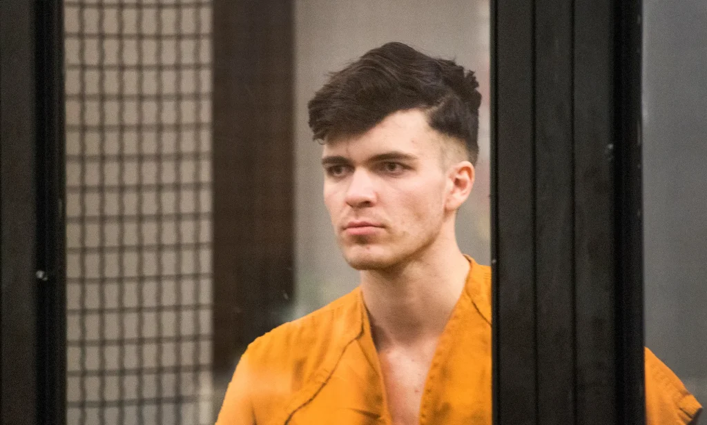 A picture of Sam Woodward in a cell box during a court case.