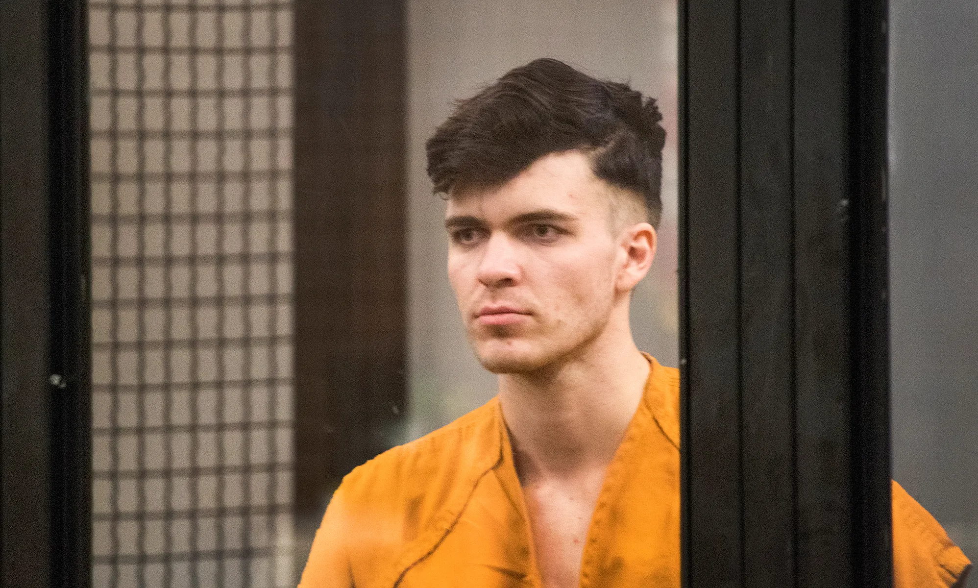 A picture of Sam Woodward in a cell box during a court case.