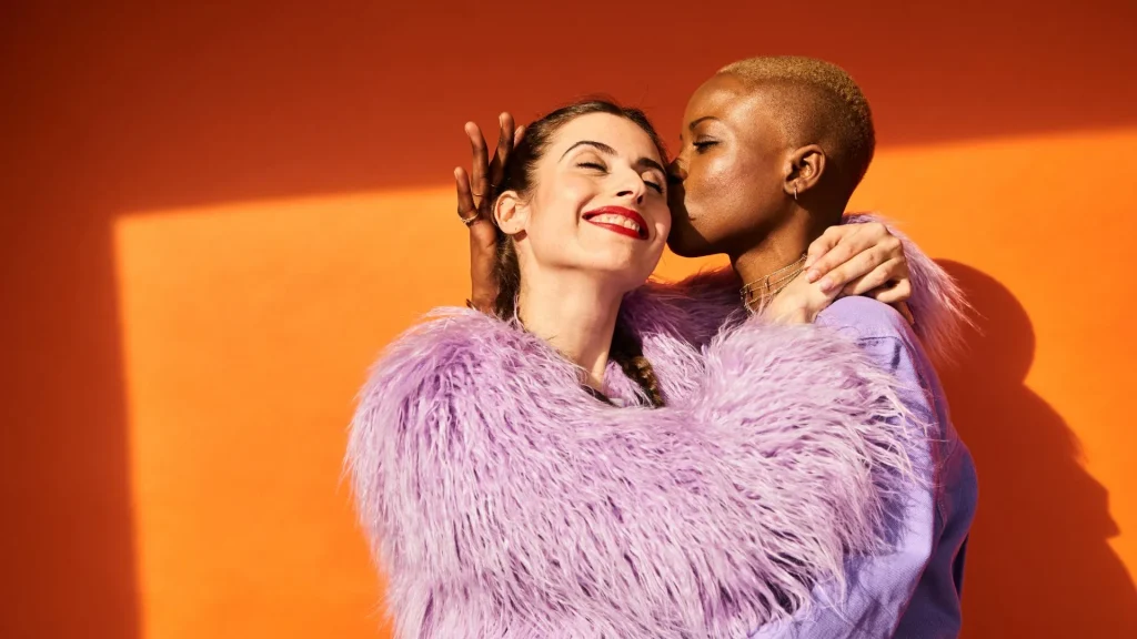 Bright, colourful image of an LGBTQ+ couple