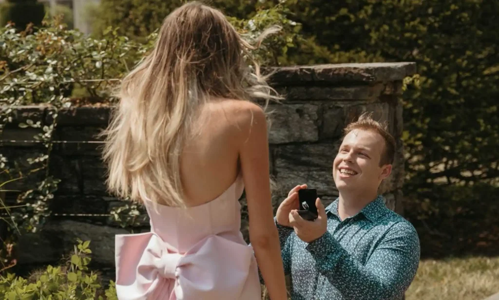 Addison Smith down on one knee proposing