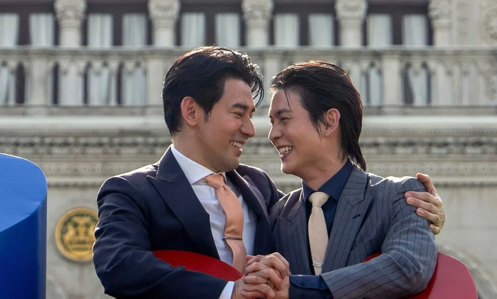 Members of the LGBTQ community celebrate after the Thai parliament passed the final senatorial vote on the same-sex marriage bill, at Government House in Bangkok on 18 June, 2024.