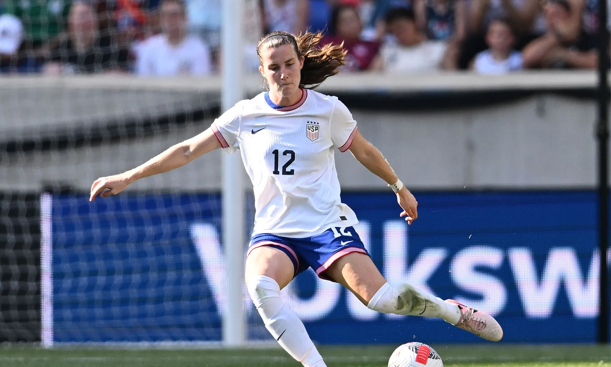 USWNT player Tierna Davidson, who identifies as LGBTQ+, kicking a ball