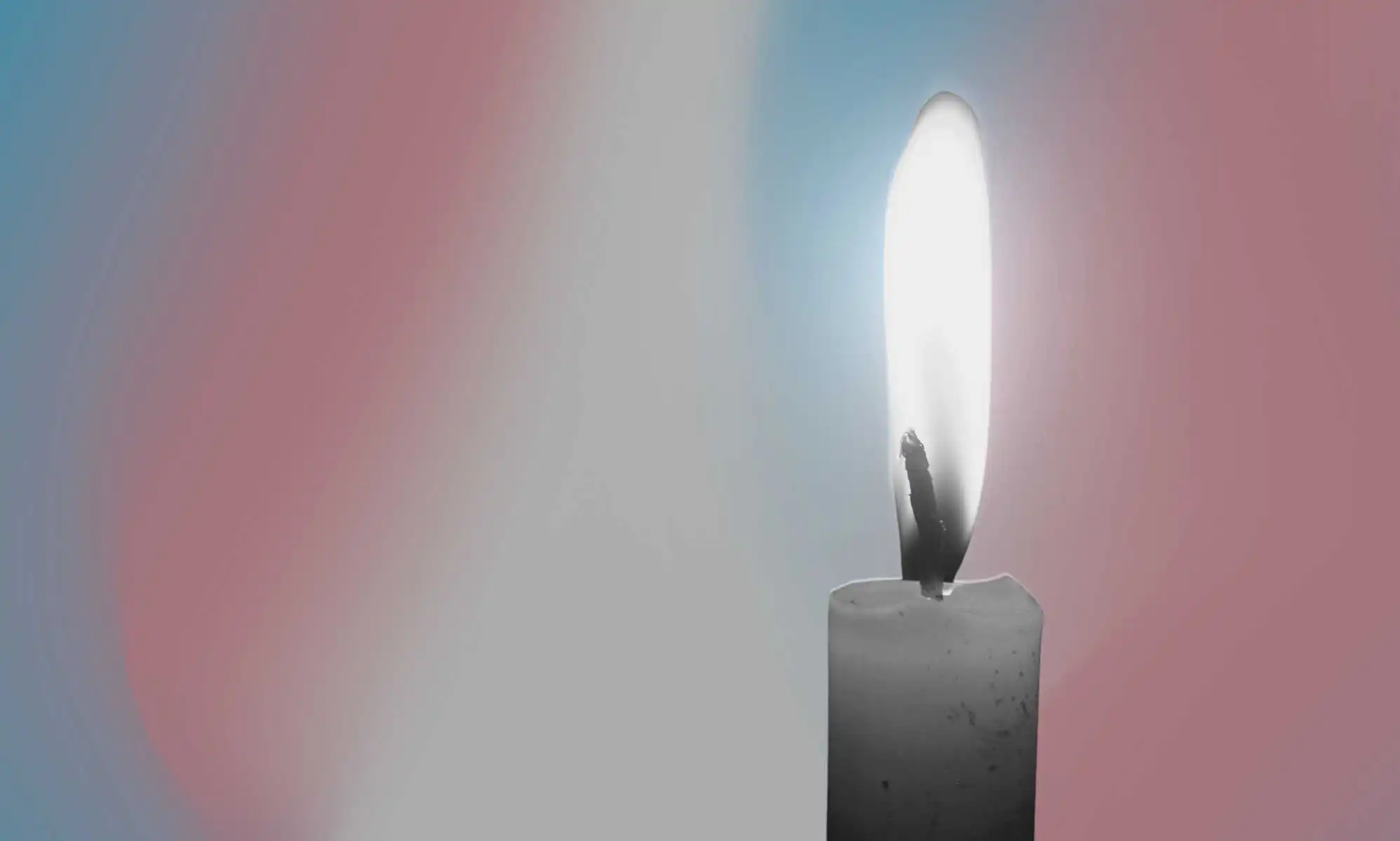 a candle with a trans hue
