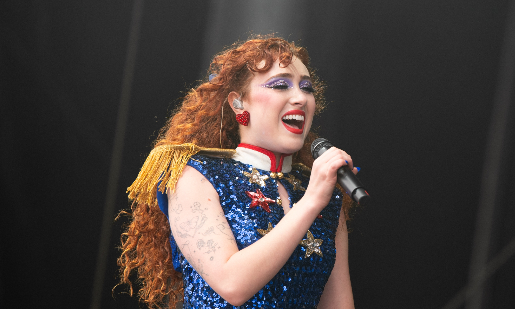 Chappell Roan performs at Outside Lands at Golden Gate Park, wearing a sparkly blue sequin vest top.