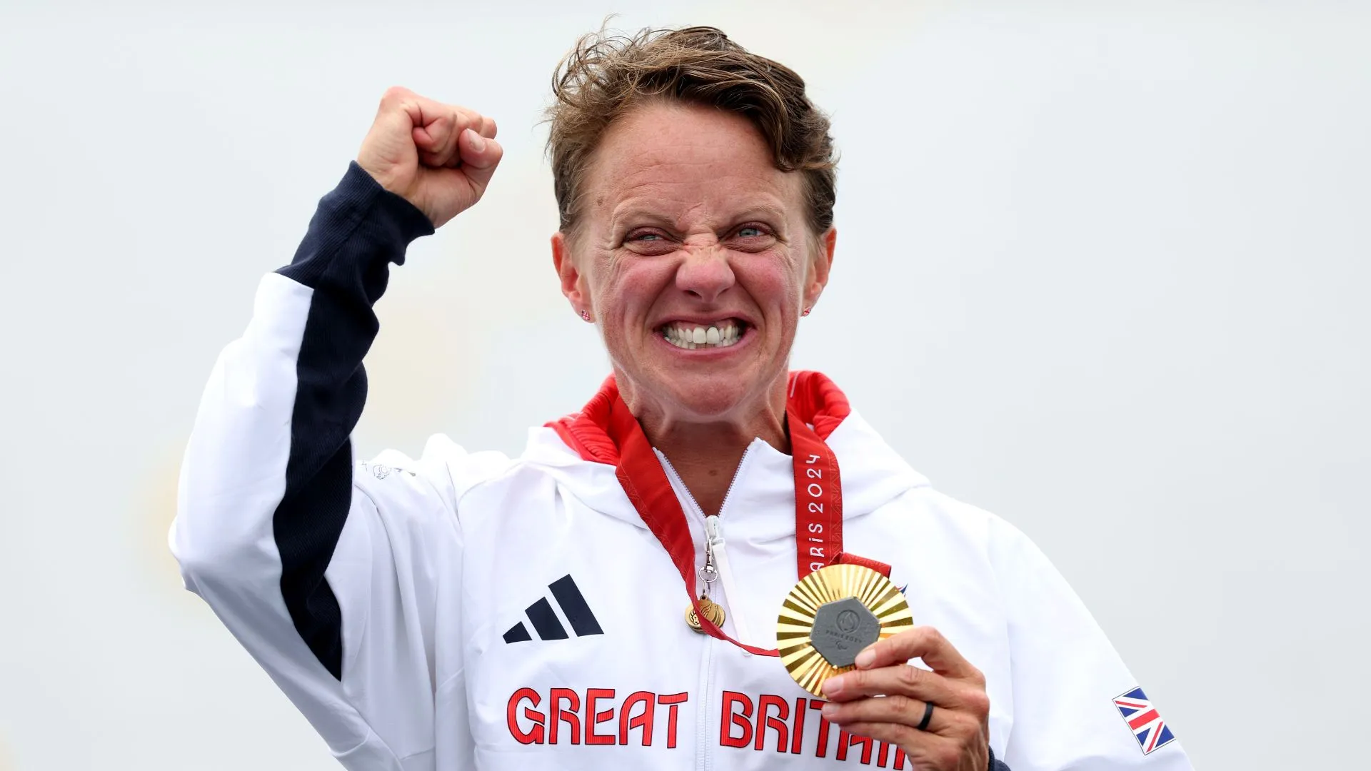 Gold medalist Emma Wiggs of Team GB celebrates on the podium at the Paris Paralympic Games 2024