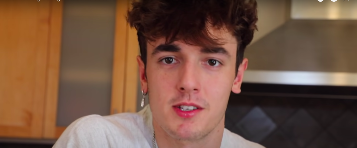 Bryce Hall looks into the camera while wearing a white t-shirt.