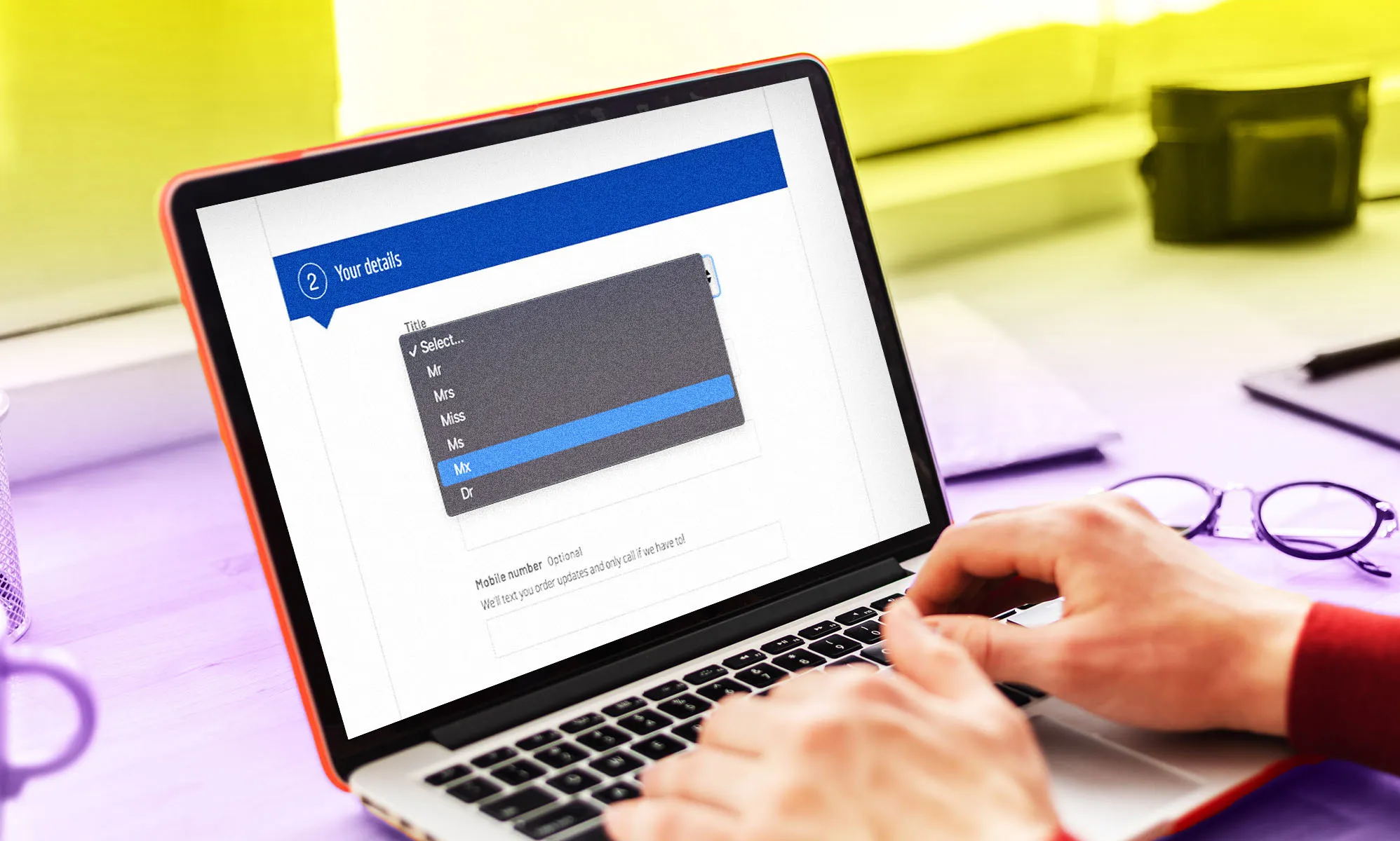 A laptop with a customer form on the screen and the gender-neutral title
