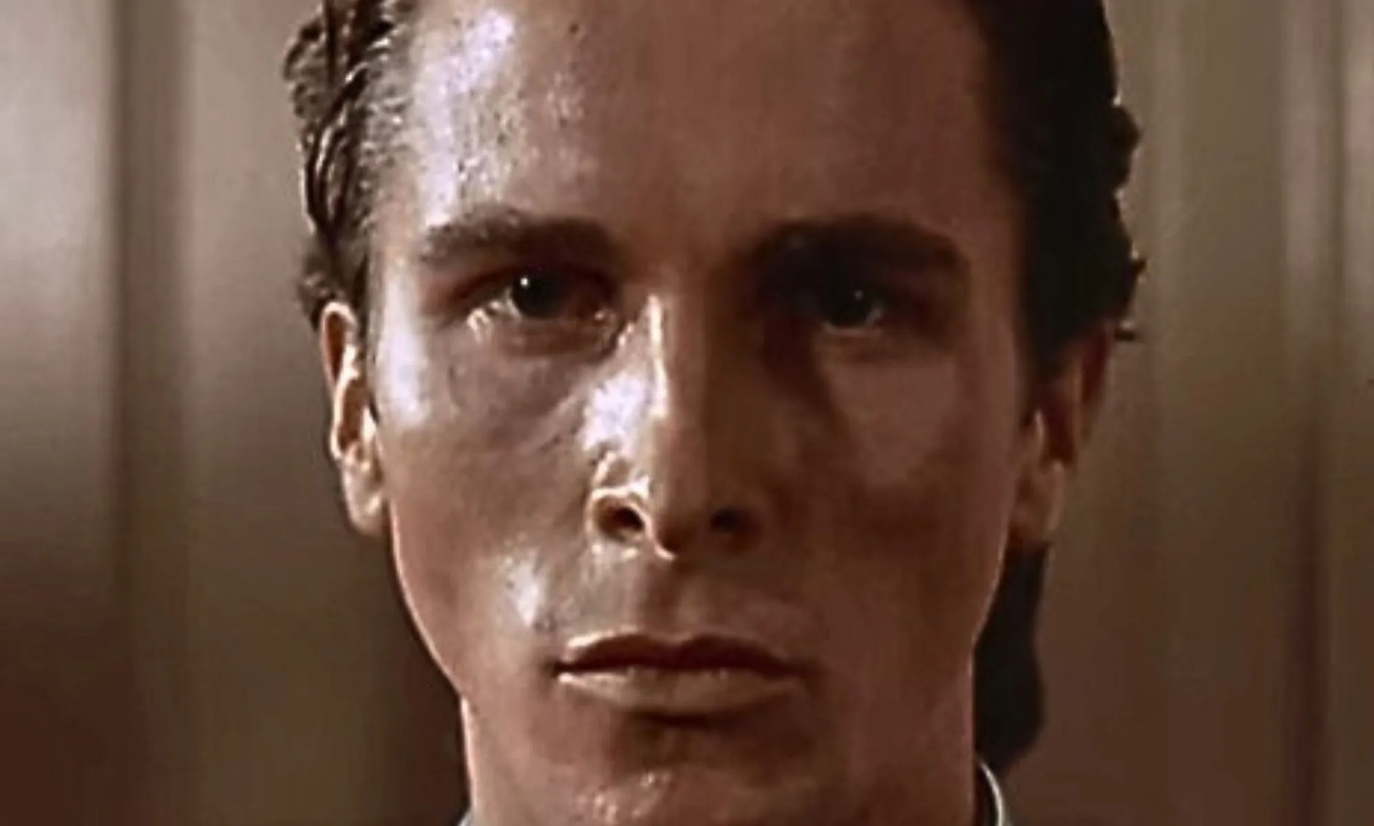 A close-up of Patrick Bateman in American Psycho.