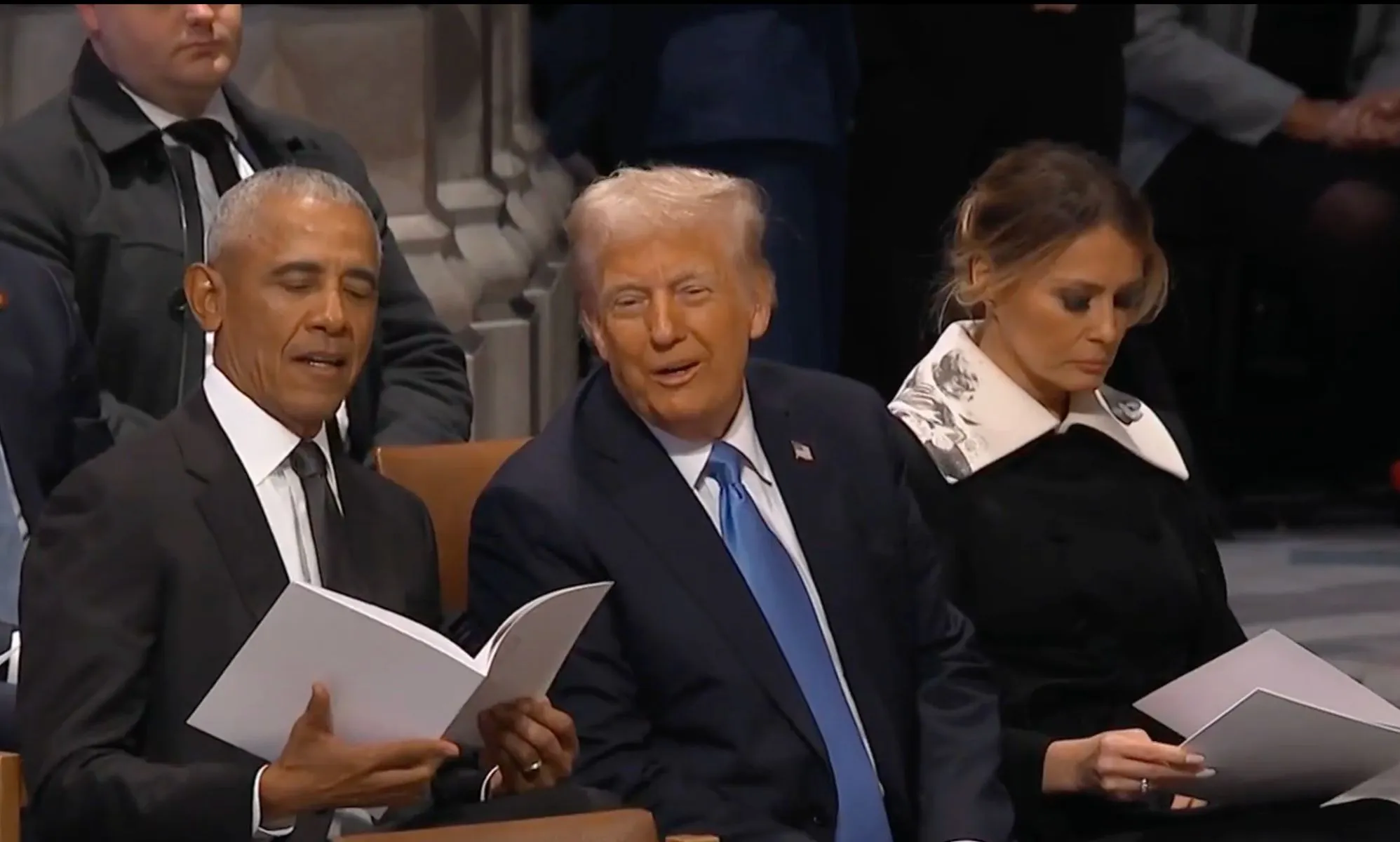 Barack Obama, Donald Trump, and Melania Trump sitting together at Jimmy Carter