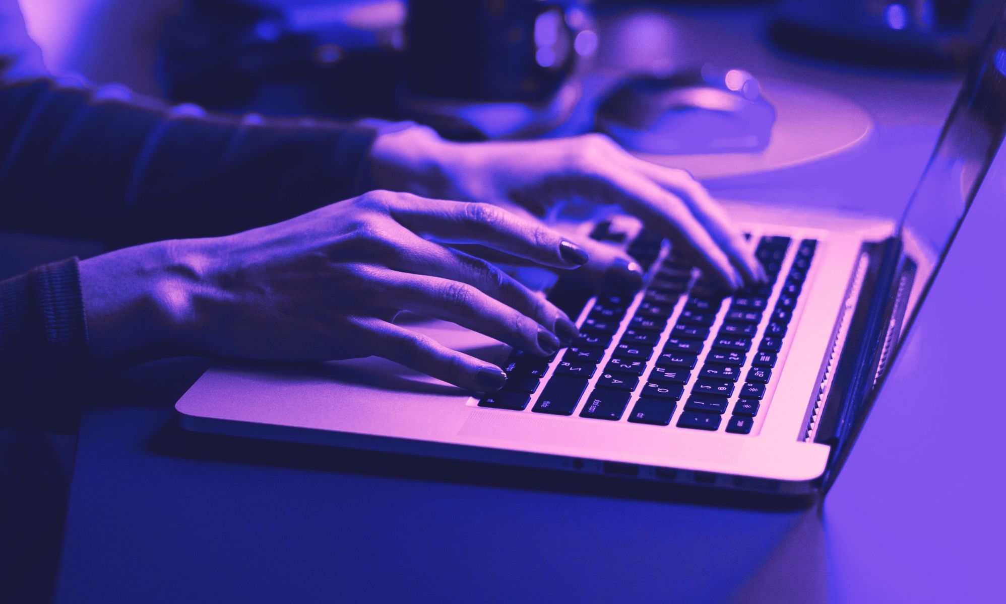 A person typing on a computer.