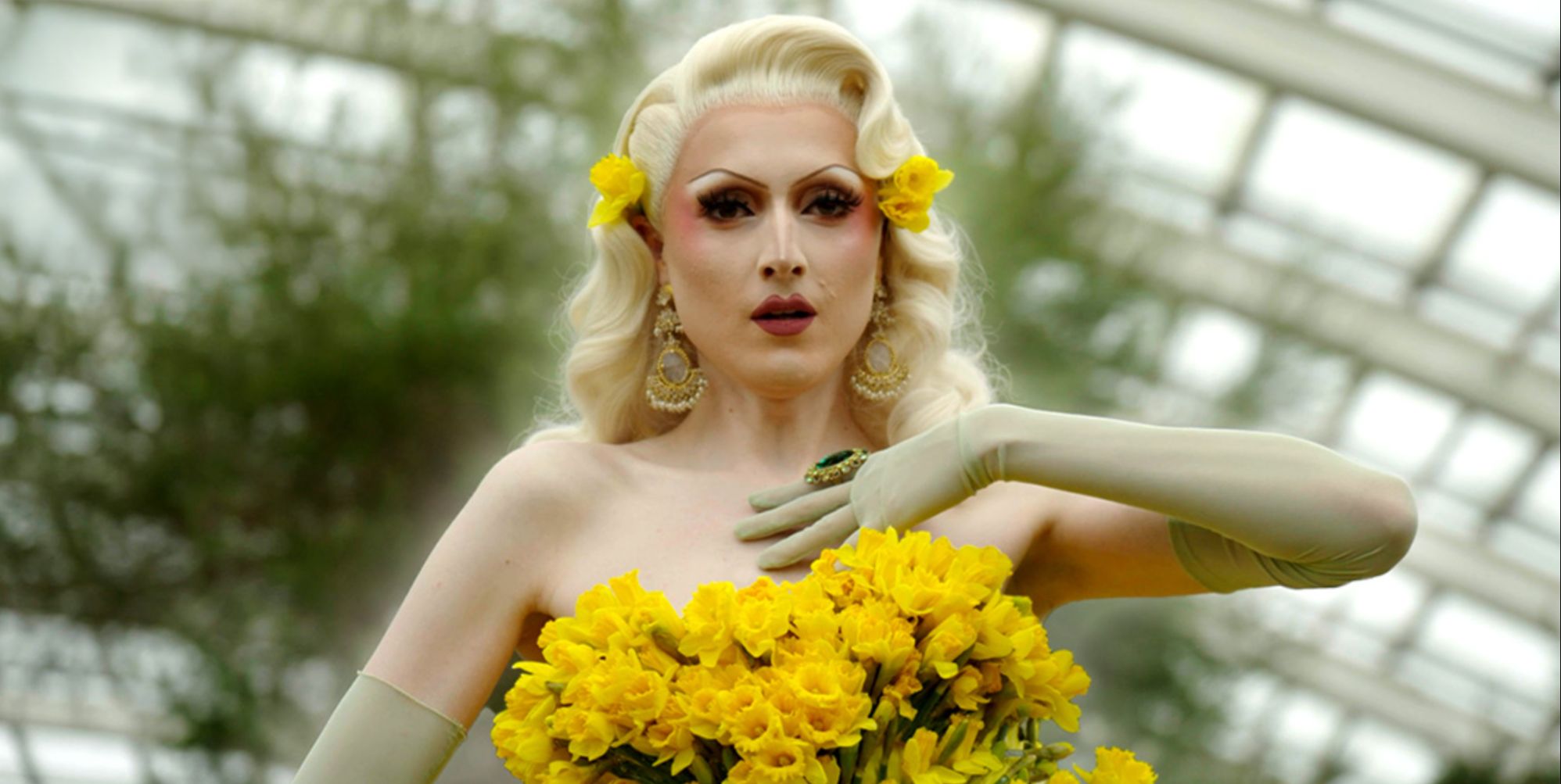 Drag star Marmalade in a yellow dress made of daffodils
