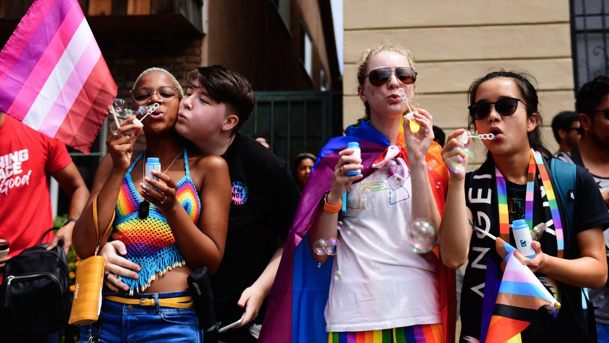 Attendees blow bubbles during the 2022 Long Beach Pride Parade on July 10, 2022 in Long Beach, California