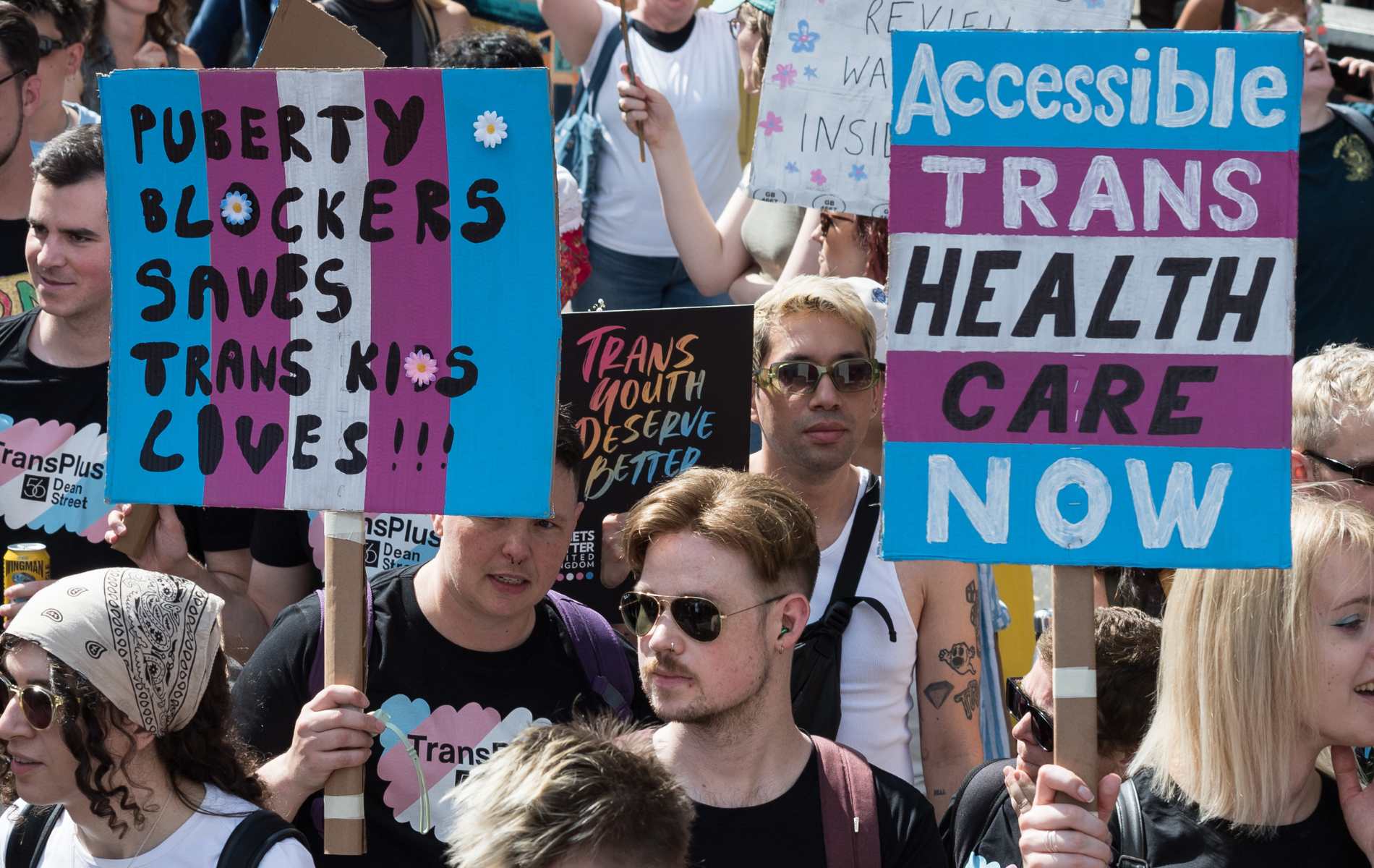 Protesters carry placards against the ban on puberty blockers and for accessible trans healthcare as transgender people and their supporters march through central London during the sixth Trans Pride protest march for transgender freedom and equality in the UK and globally in London, United Kingdom on July 27, 2024.