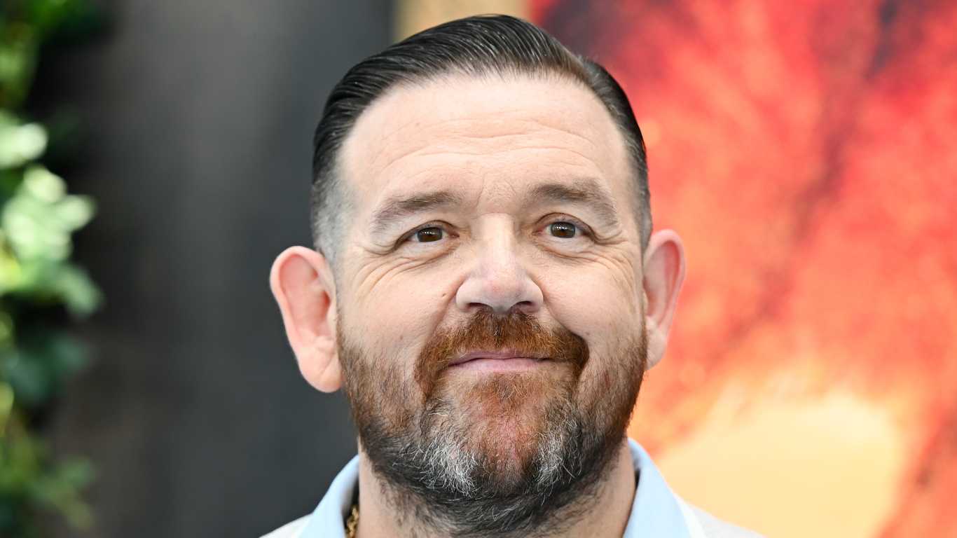 Nick Frost smiling in a blue shirt.
