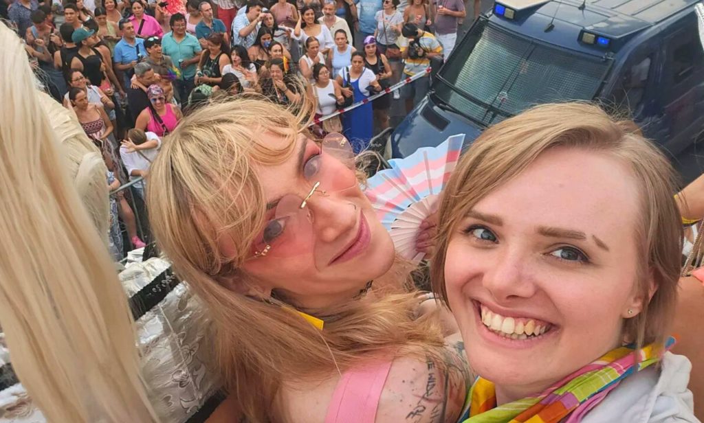 Two women smiling for a selfie.