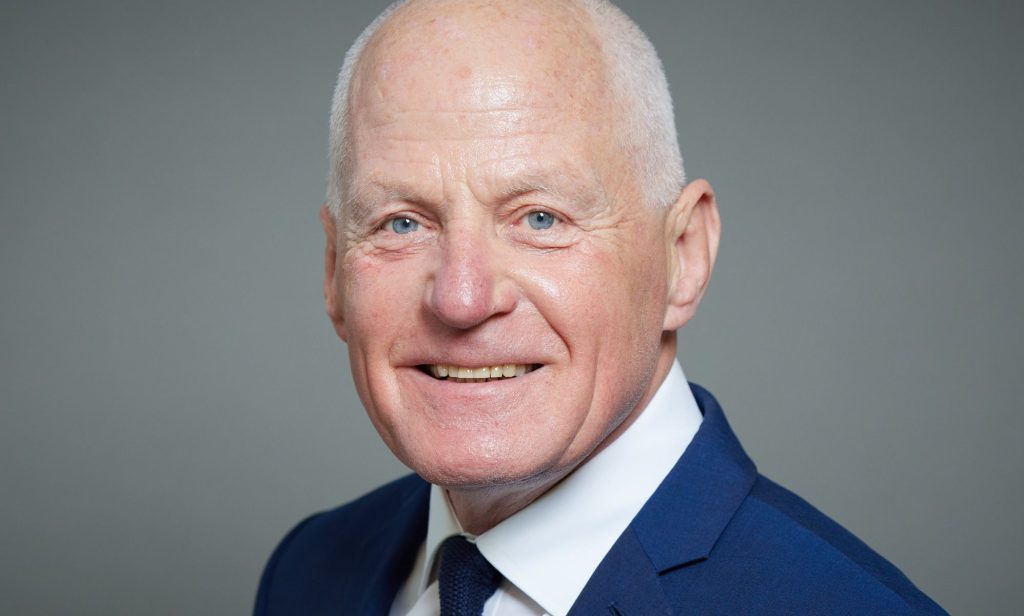 The official government portrait of Lord Michael Cashman.