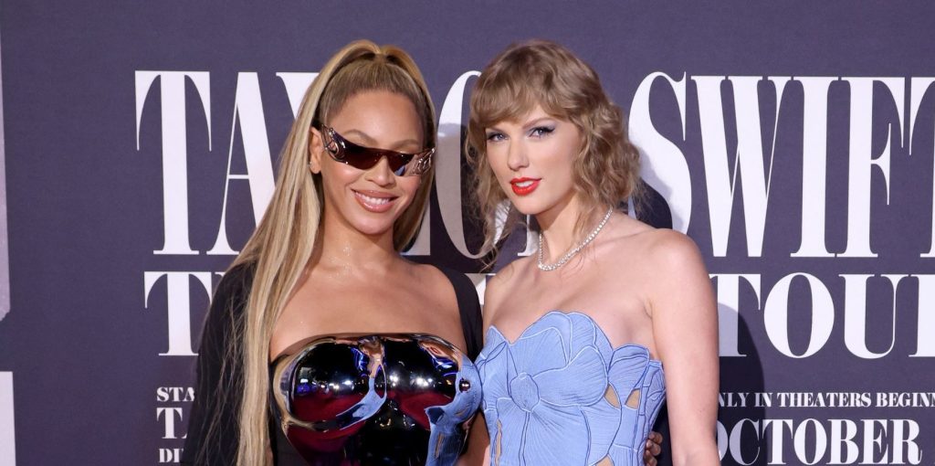 Beyoncé and Taylor Swift stand next to one another at the Taylor Swift: The Eras Tour film premiere.